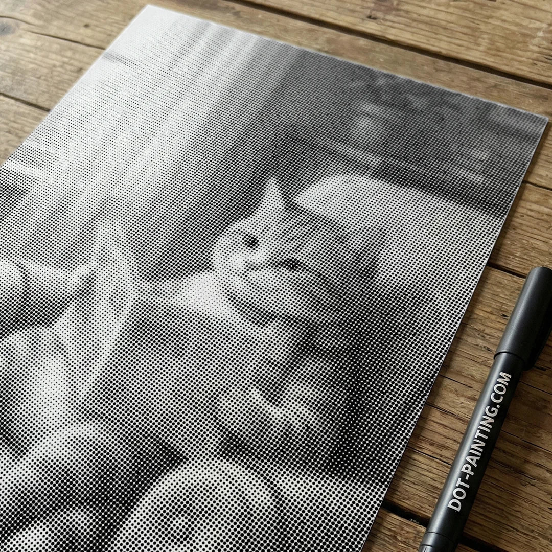 Chat sur une peinture à points de canapé